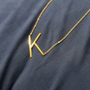 Gold tone K necklace